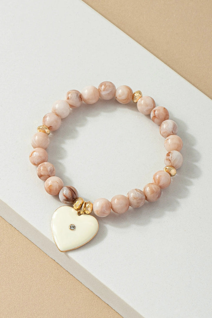 Pulsera Elástica de Cuentas con Dije de Corazón - Elegancia y Estilo by Yanet Collective