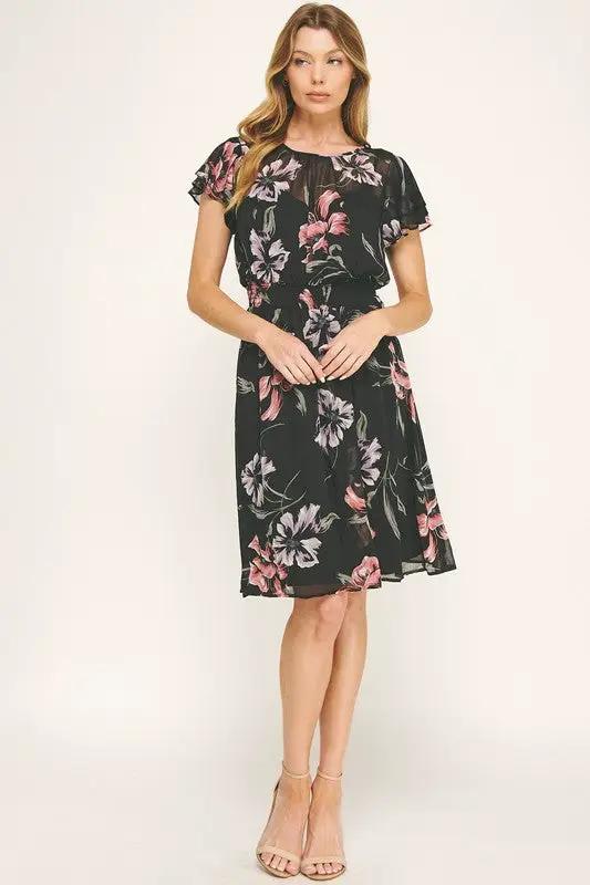 Vestido Negro de Gasa con Estampado Floral y Cintura Fruncida con Volantes by Yanet Collective