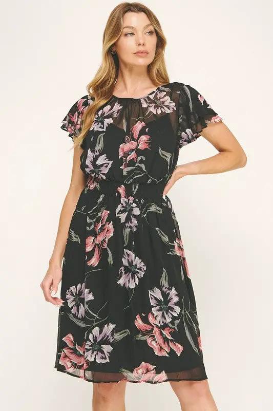 Vestido Negro de Gasa con Estampado Floral y Cintura Fruncida con Volantes by Yanet Collective