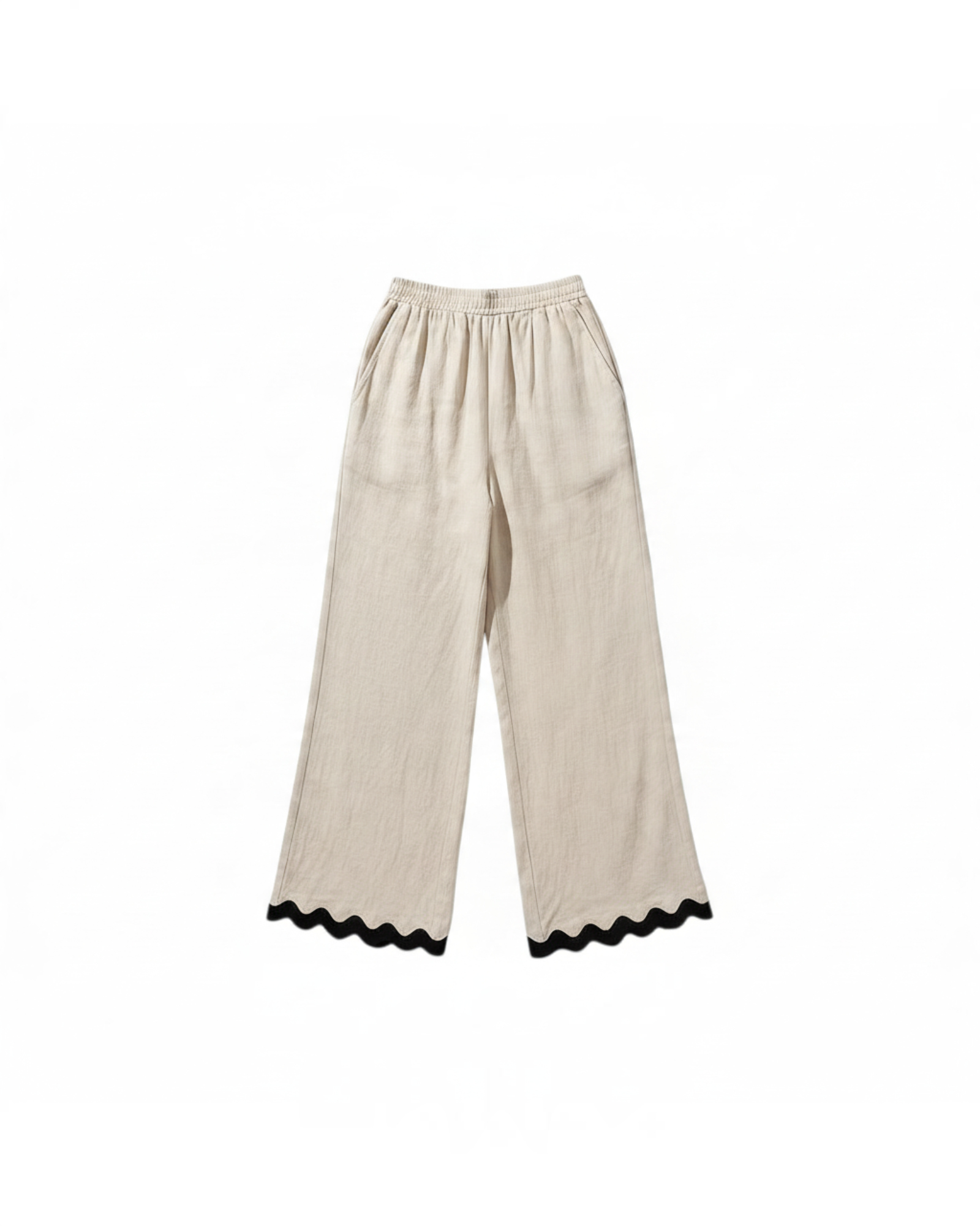 Pantalones wide-leg beige de Yanet Collective con cintura elástica y detalle de ribete negro ondulado en el bajo