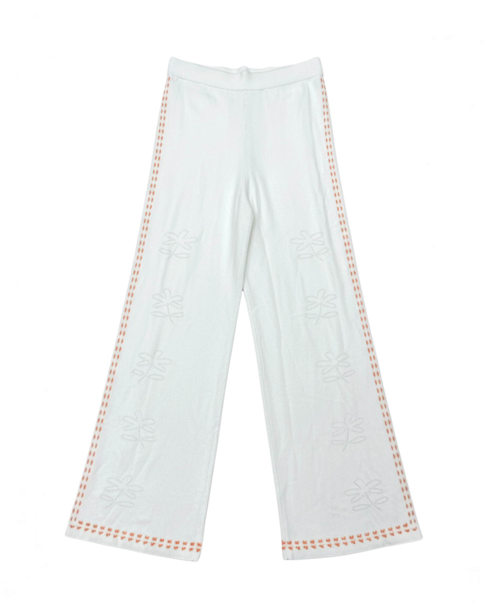 Pantalones Yanet Collective de pierna ancha en color blanco con bordados florales y detalles en los laterales