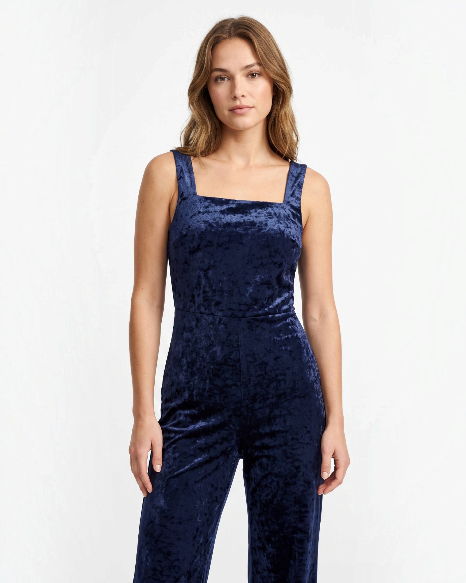 Studio photo of Palazo azul marino Standing facing the camera, natural confident posture, arms relaxed at sides, front view, full body visible. CAMERA SHOT: A FULL BODY shot capturing the person from head to toe. [Upper body focus]